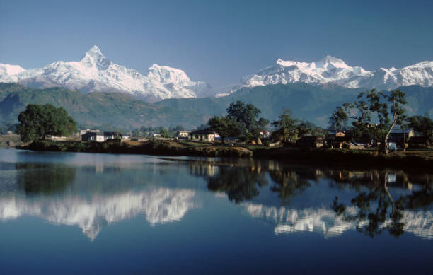 View of Machapuchare (Fishtail mountain) and the Himalaya from Damside at Pokhara, Nepal