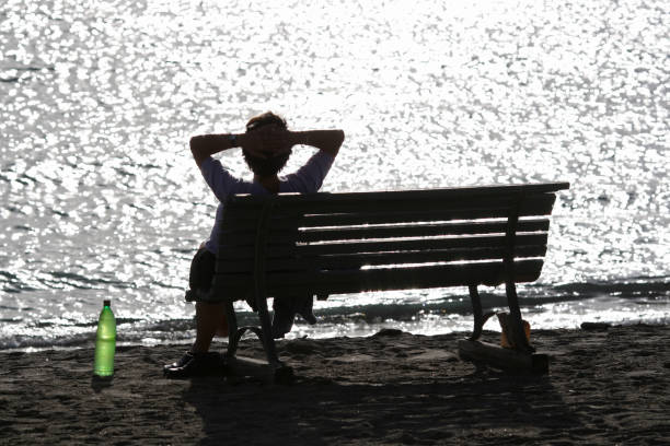 istock Woman relaxing by the Mediterranean Sea 157191881
