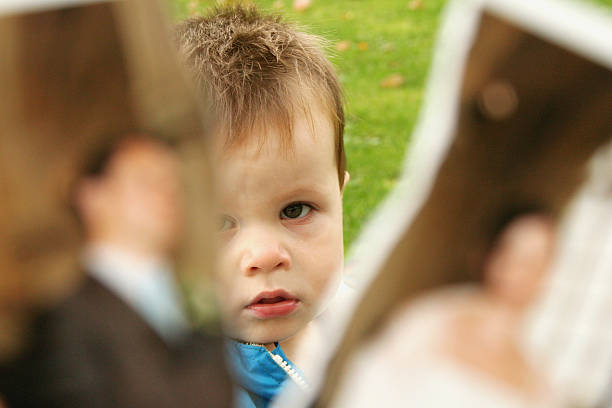 Boy separated by the figure of divorce stock photo