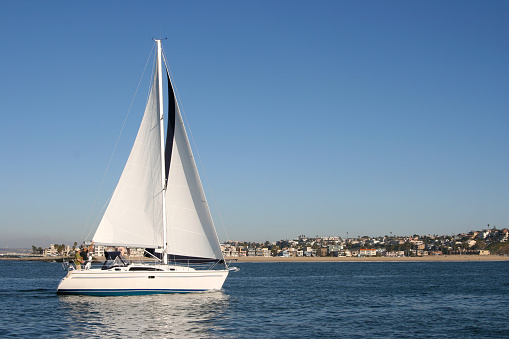 Large 30+ ft sailboat on California coast