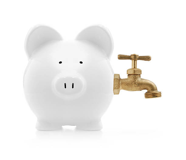 istock piggybank with faucet 157192610