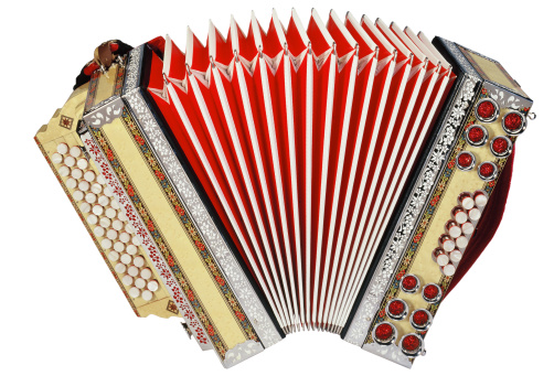 Small retro bayan (accordion). Folk musical instrument. Isolated on white background.