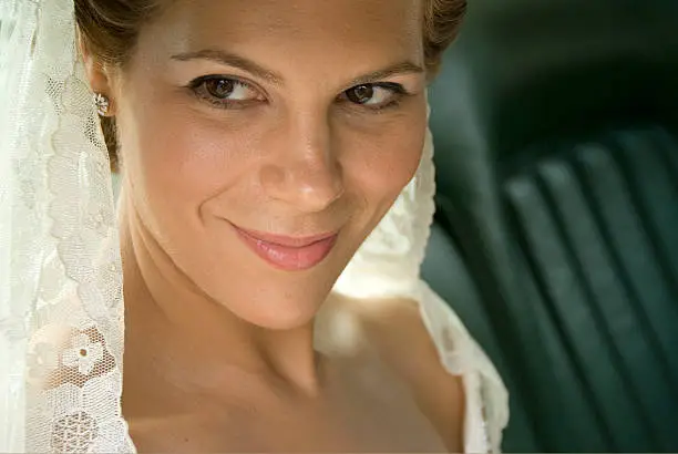 A lovely bride in the car - closeup of her face