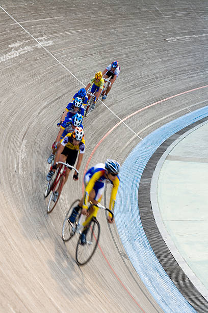 istock cyclists racing in bicycle velodrom 157193110