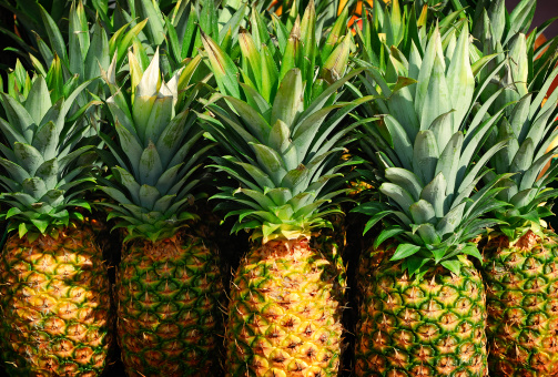 pineapples in a market place