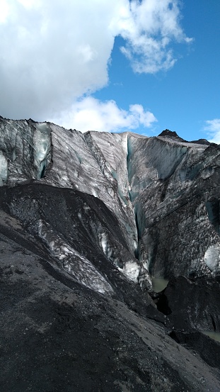 Eyjafjallajökull glacier in Iceland where ice is covered in ash resulting in a beautiful black and white combination