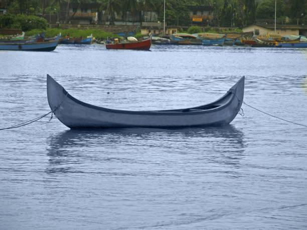 A small fishing boat in water, Kannur, Kerala, India
