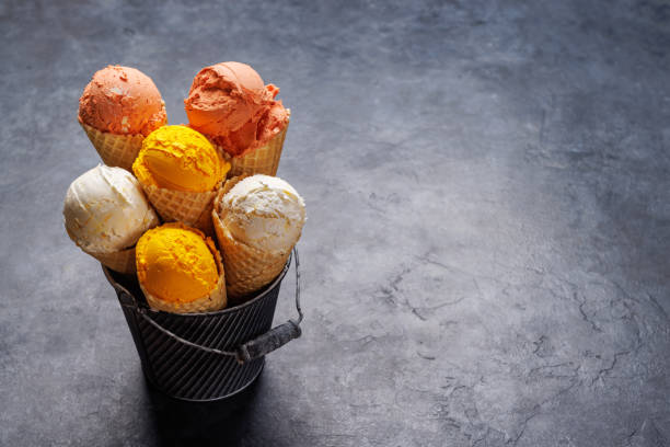 istock Assorted ice cream flavours in delightful waffle cones 1571936052