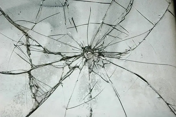 Photo of Broken Glass Window Bullet Shooting impact hole cracks