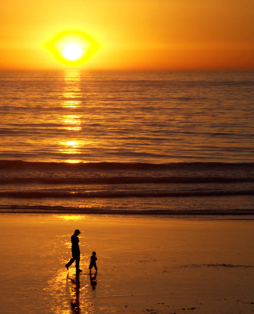 istock Woman with child on beach 157193865