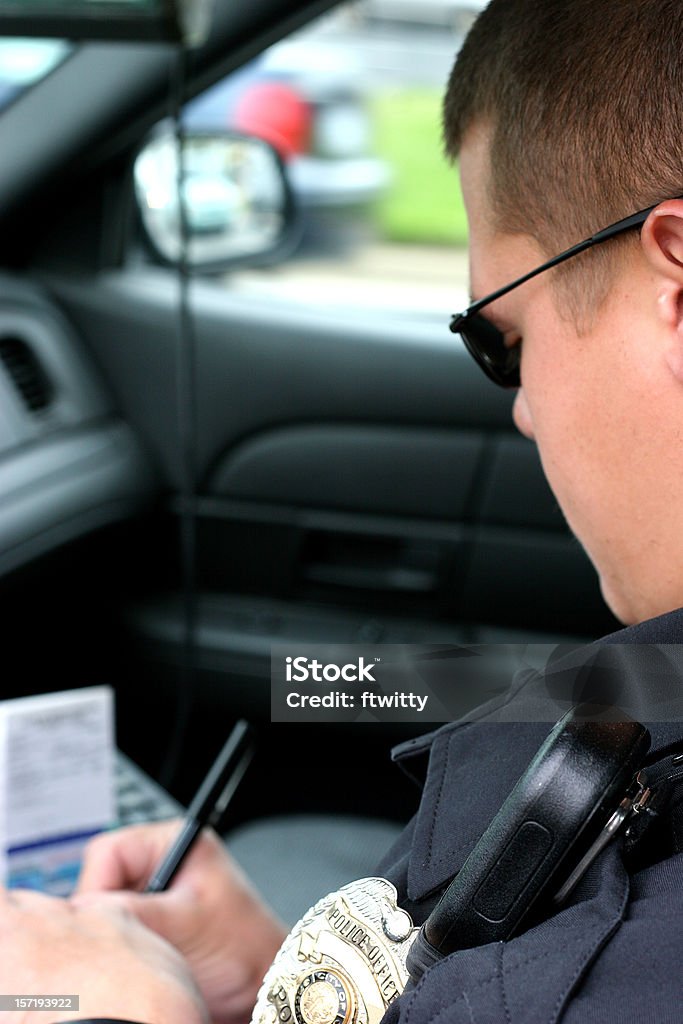 Police Officer Writing Ticket Vertical  Community Outreach Stock Photo