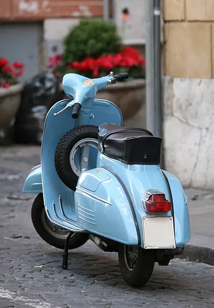 Photo of Blue Italian vintage scooter in Rome, Italy