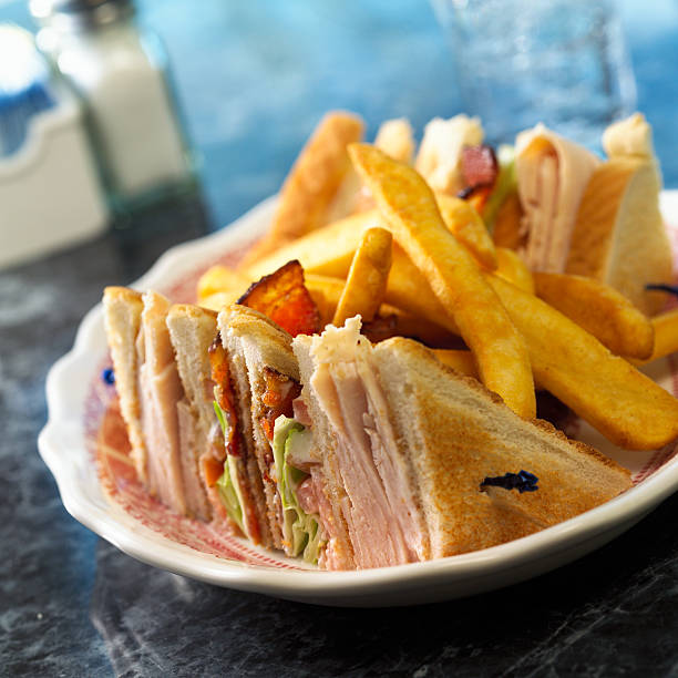 istock Turkey Club Sandwich with fries 157194265