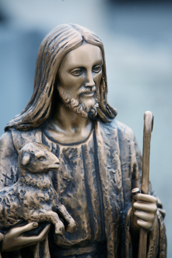 Jesus statue with lamb.