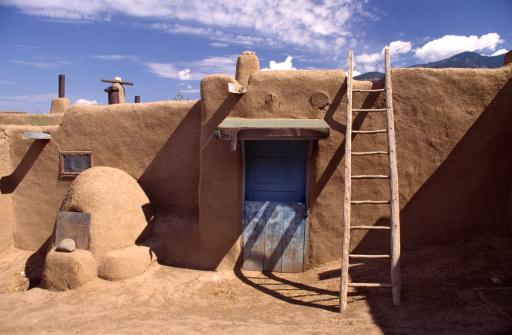 Examples of adobe architecture in Taos Pueblo, New Mexico, a multistory adobe complex inhabited by Native Americans for centuries. A longtime artist colony, Taos also offers many galleries and museums showcasing regional artwork, including the Harwood Museum of Art and the Taos Art Museum.  This is a popular tourist destination for travelers to the Sant Fe area.