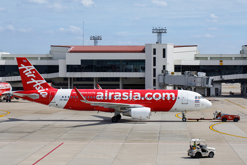 BANGKOK , THAILAND - JUL 26 2023 : Thai Airasia On Taxiway at Don Mueang International Airport in Bangkok, Thailand.