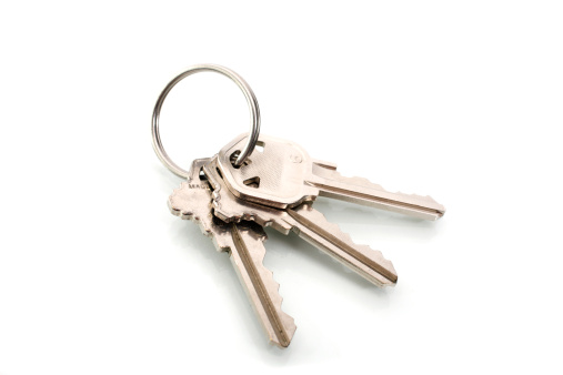 Keychain with key ring isolated on white background. Concepts for real estate and moving home or renting property. Buying a property. Mock-up keychain.Copy space.