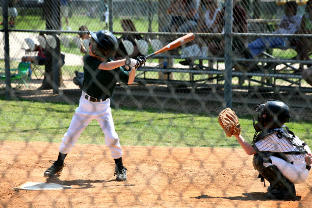 istock Sports: Little league baseball player at bat. 157195395