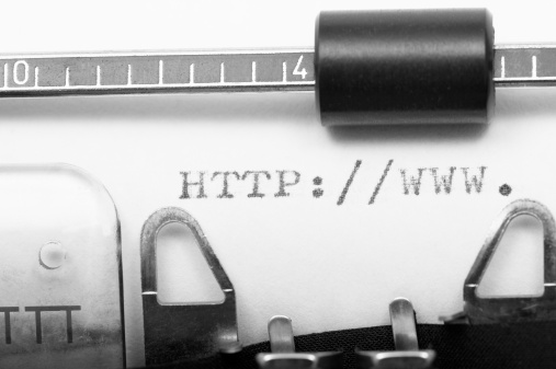 Press Release phrase closeup being typing and centered on a sheet of paper on old vintage typewriter mechanical.