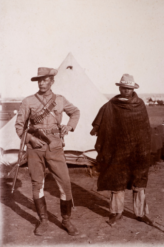 Vintage photograph of a Victorian British soldier and his African manservant.   From the era of the Boer war, in South Africa.