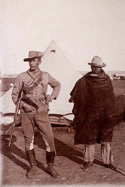 Victorian Soldier Vintage photograph of a Victorian British soldier and his African manservant.   From the era of the Boer war, in South Africa. colonial style photos stock pictures, royalty-free photos & images