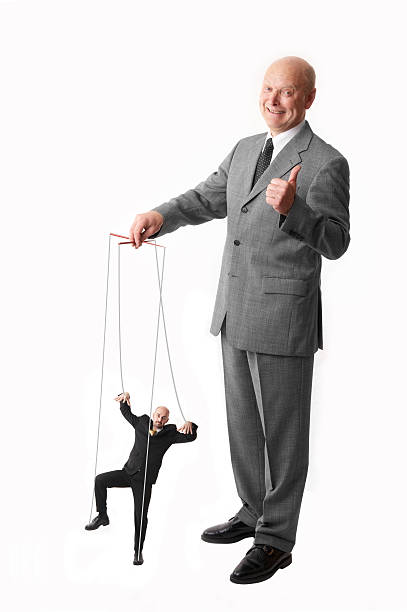 puppet on a string boss having his employee on a string fascism photos stock pictures, royalty-free photos & images