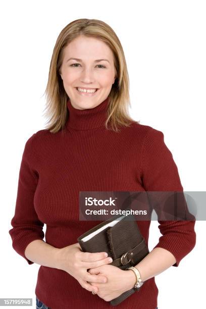 Sonriente Niña Sostiene Libro Foto de stock y más banco de imágenes de Adulto - Adulto, Agarrar, Belleza