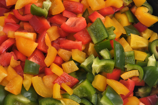 Pieces of peppers of different colors cut close-up