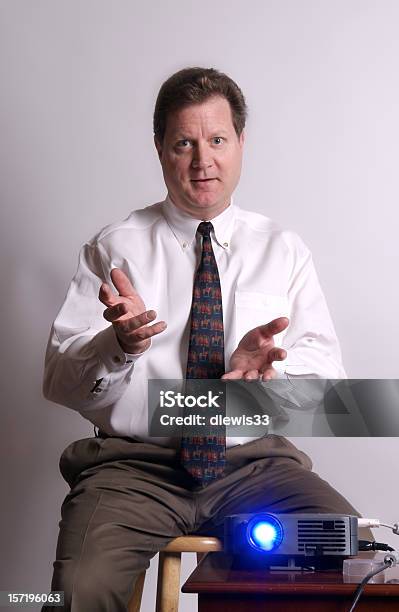 Businessman With Projector Doing Presentation Stock Photo - Download Image Now - Only Men, Persuasion, Presentation - Speech