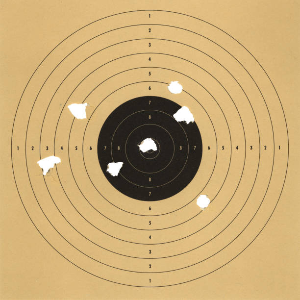 target practice an old paper target with bullet holes bullet hole stock pictures, royalty-free photos & images