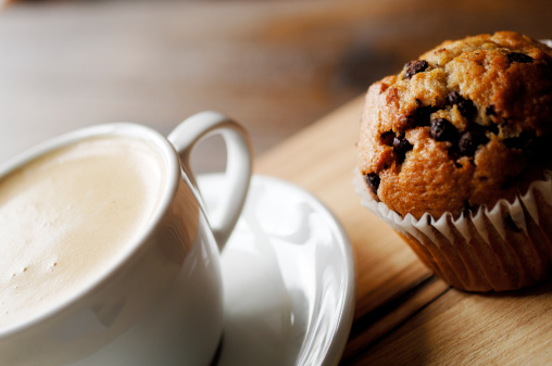 chocolate chip muffin and cup of coffee.