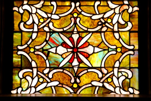 Antique stained glass window in sanctuary 