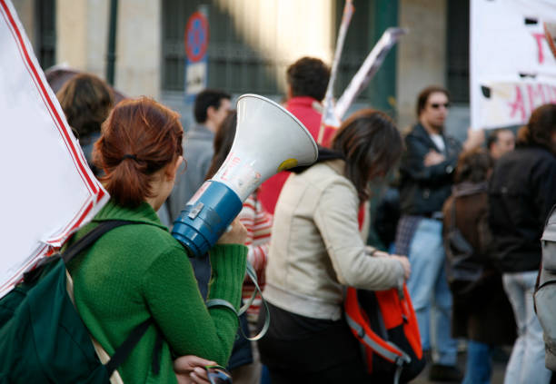 Student demonstration University students waving banners during an educational march in Athens, Greece. protestor stock pictures, royalty-free photos & images