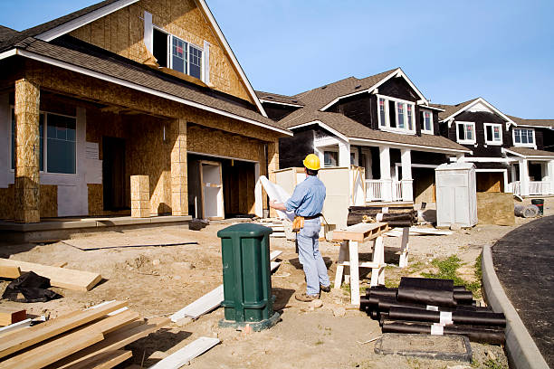 istock Man doing quality control inspection of a house being built 157197343