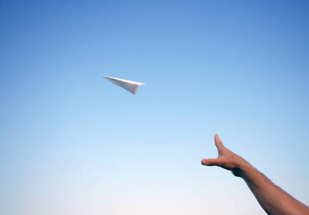 Throwing a Paper Airplane stock photo