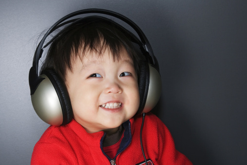 Young boy listening to music.