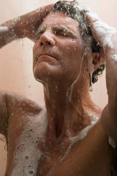 istock Man washing his hair 157197521