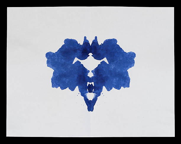 Traditional Rorschach Inkblot, blue ink on paper used stock photo