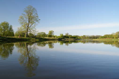 A calm river on a clear spring day. Grand River, Waterloo, Ontario. 