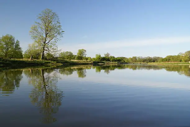 A calm river on a clear spring day. Grand River, Waterloo, Ontario. 