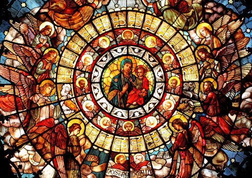 Rose window stained glass, dedicated to the Madonna of the Health, located in the San Camillo Church in Milano, Italy. This wonderful \