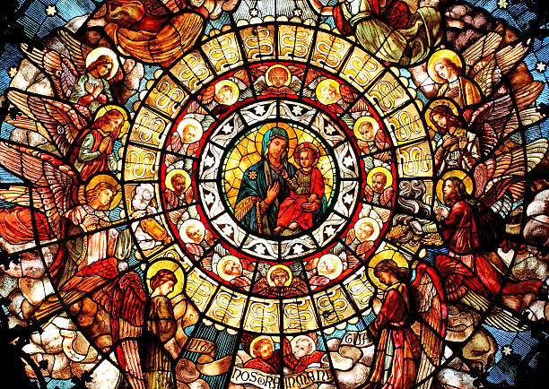 Madonna of Health Rose window stained glass, dedicated to the Madonna of the Health, located in the San Camillo Church in Milano, Italy. This wonderful "gothic rosone" was created by an anonymous stained glass artist in the end of the nineteen century, and gifted to the church as a sign of devotion to the Madonna of the Health, who is the protector of the unhealthy people. stained glass photos stock pictures, royalty-free photos & images