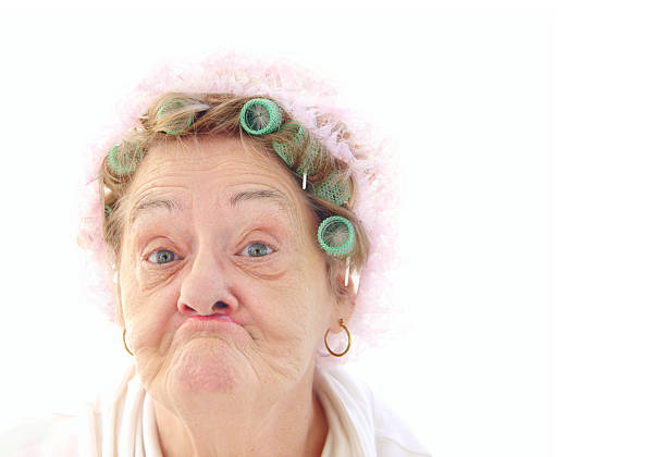 senior pucker face senior in rollers. ugly face stock pictures, royalty-free photos & images