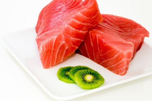 Fresh ahi steaks with some slices of kiwi on the side.  Goes down so well.
