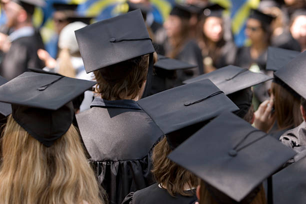 istock Graduation day with many students wearing caps 157197919