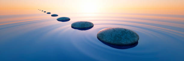 istock Row of stones in calm ocean 1571979279