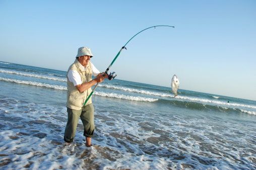 Senior man fishing.