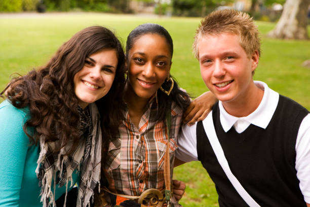 istock further education: diverse smiling friends posing together for the camera 157198363