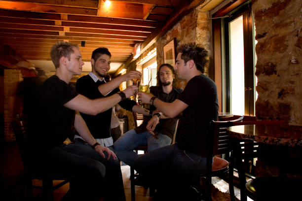 istock Multi-ethnic men friends at the bar sharing beer, drinks. Cheers! 157198603