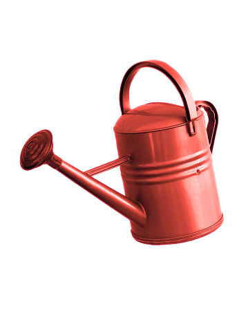 Red Watering Can Tilted Slightly and isolated on white with copy space